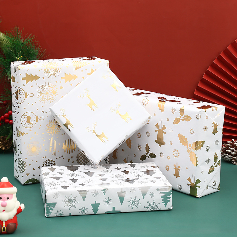 Emballage cadeau de Noël en feuille d'or