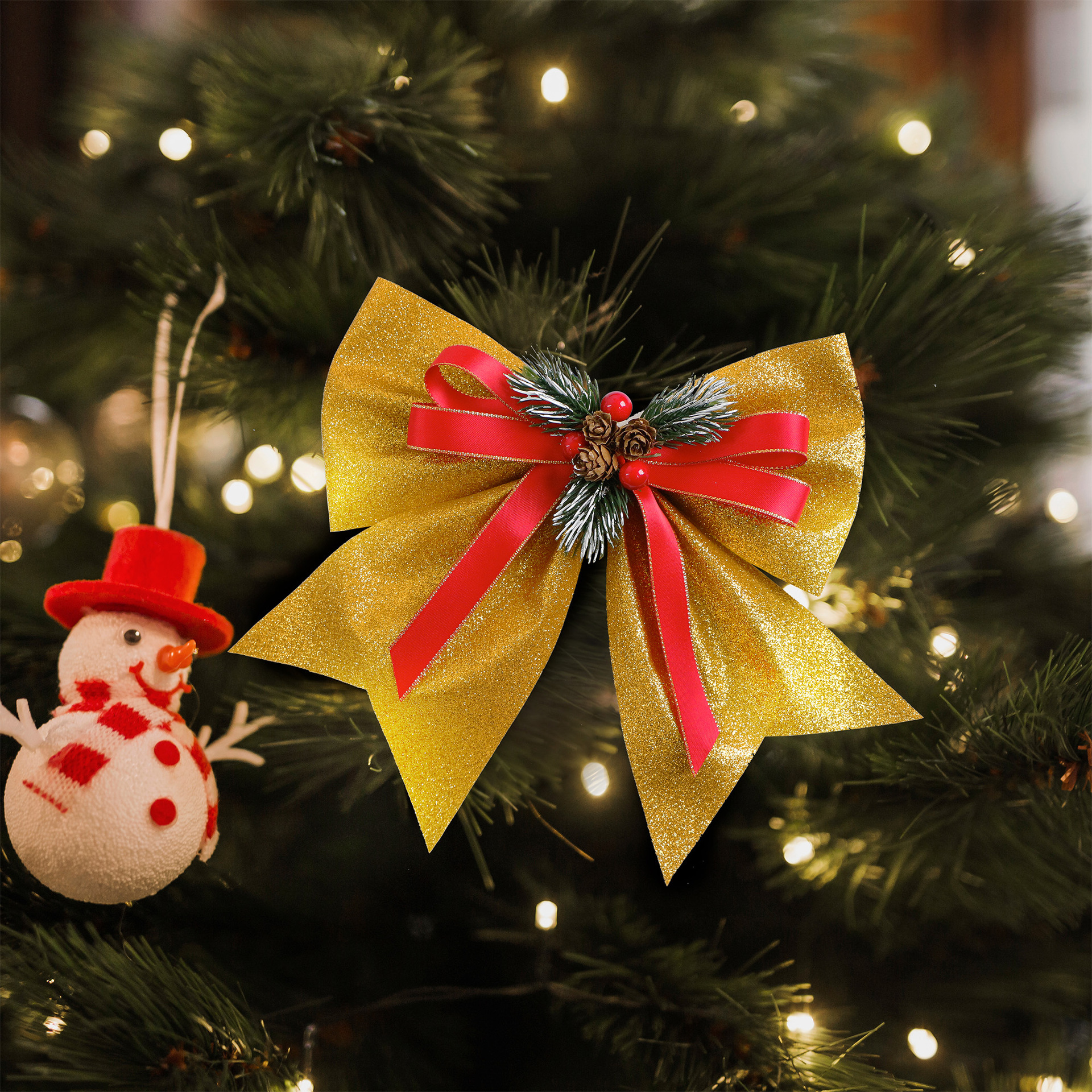 festive glitter ribbon bows for christmas tree with pinecones and berries
