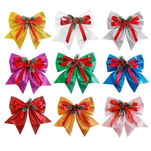 festive glitter ribbon bows for christmas tree with pinecones and berries