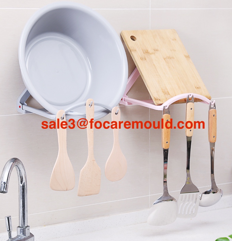 Reboundable wash basin rack plastic injection mold