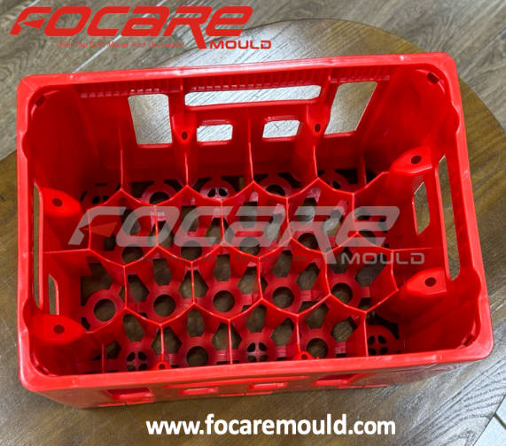 Finished red HDPE beverage crate with bottle support structure