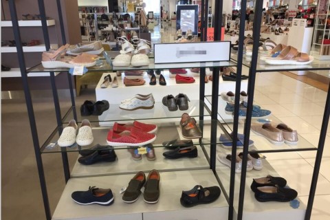 Our women leather shoes are on the customer's counter