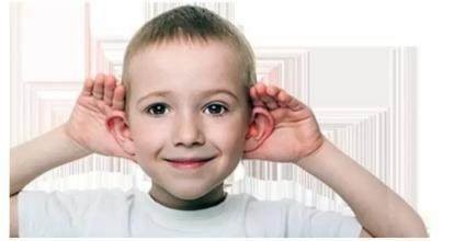 A hearing Impaired little girl in American puts on a hearing aid and laughs after hearing the family voice.